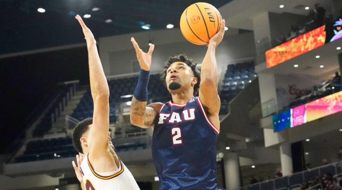 Florida Atlantic guard Nicholas Boyd (2) shoots over Loyola Chicago guard Jalen Quinn (2) during the second half of a game.
